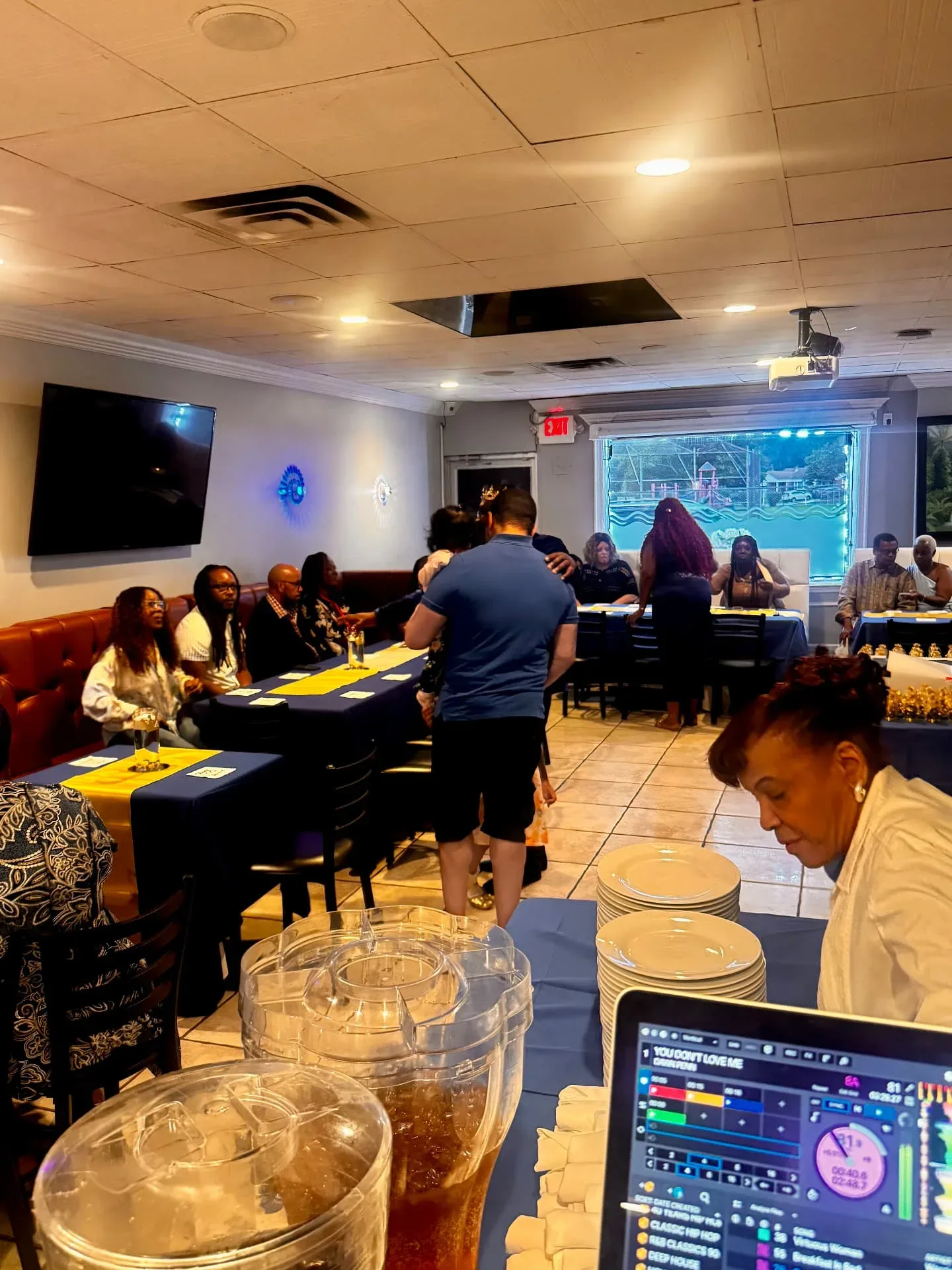 Guests gathered around tables in the Spices Negril dining room