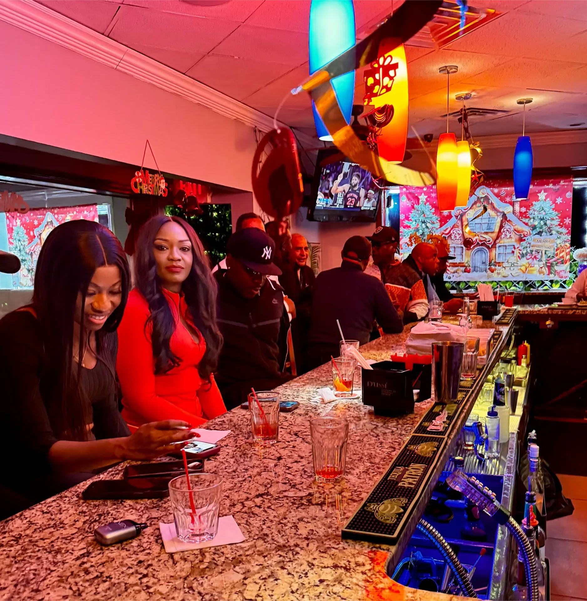 Guests at the Spices Negril bar with festive holiday decorations
