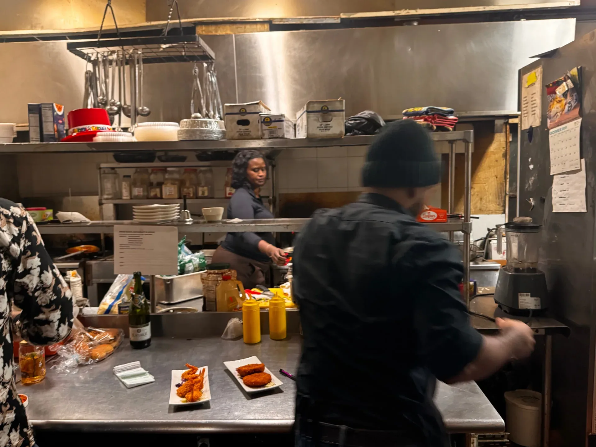 The Spices Negril kitchen team preparing dishes during service